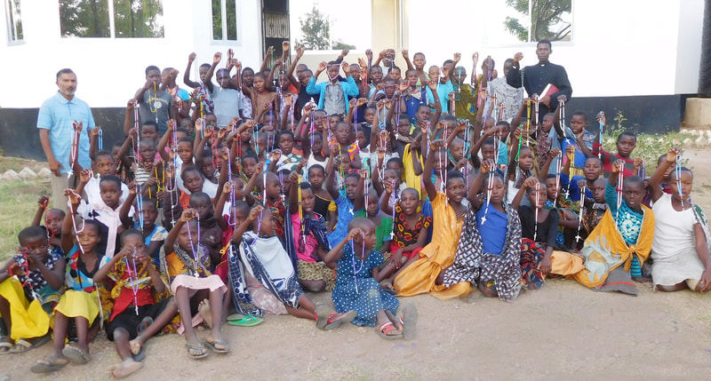 Children's Rosary Group in Tanzania with rosaries from Totus Tuus in Calgary